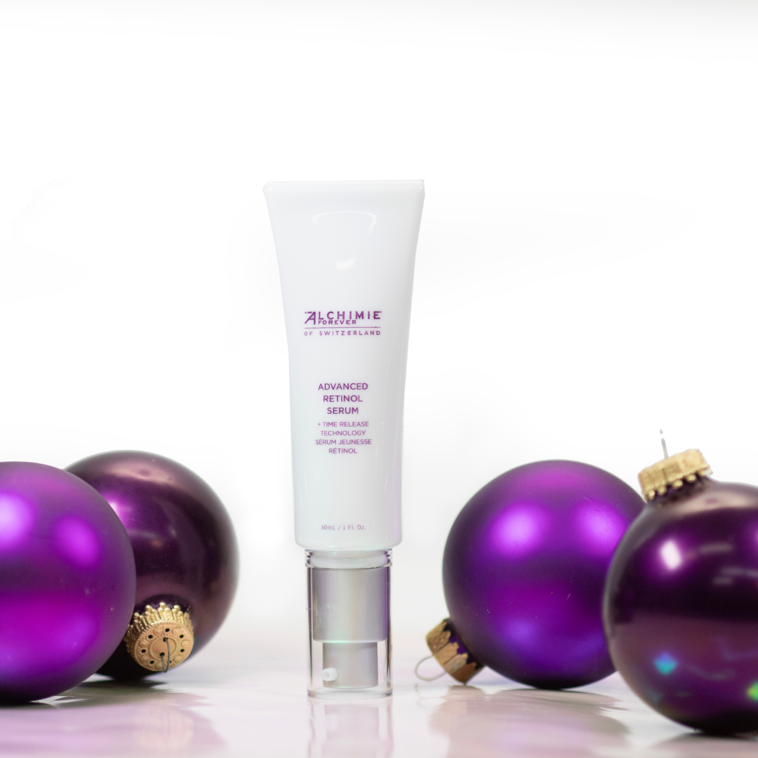 Alchimie Forever Advanced Retinol Serum bottle with purple ornaments on a white background