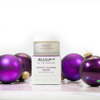Alchimie Forever Kantic Calming Cream jar with purple Christmas ornaments on a white background