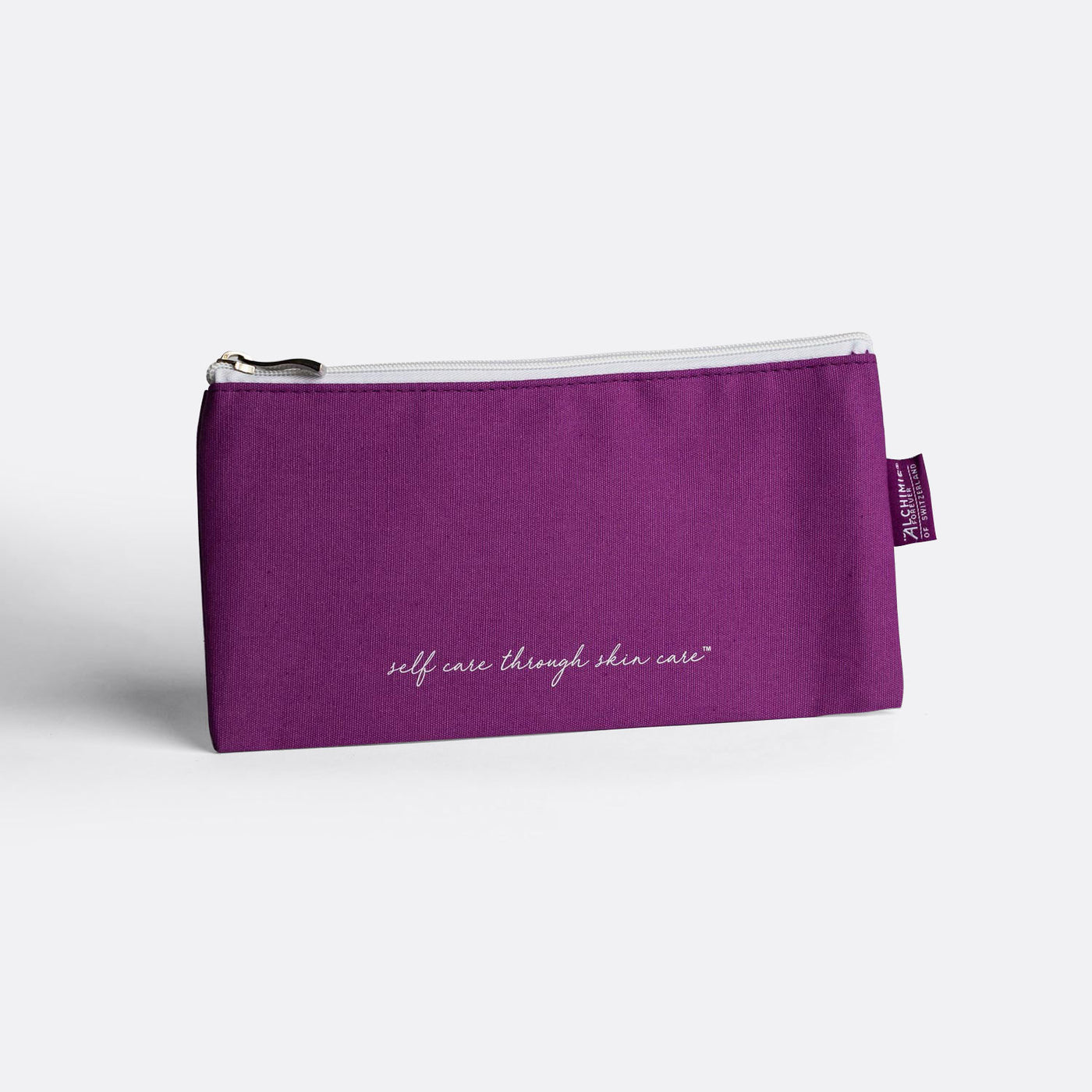 Alchimie Forever Self Care Through Skin Care purple cosmetics bag.