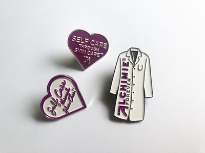 Self Care Through Skin Care™ Purple Heart Pin